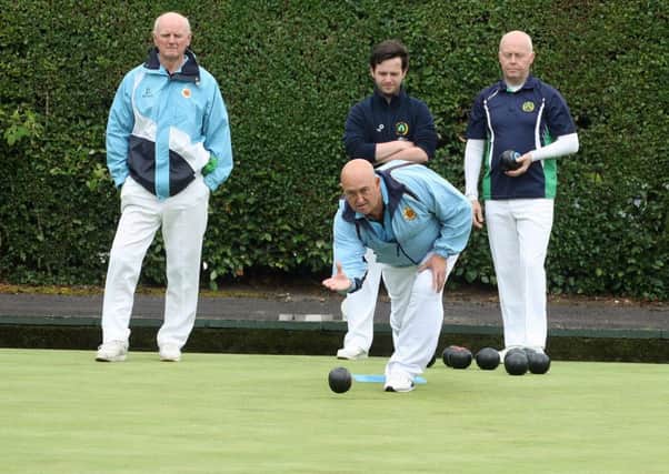 Arnold Kenny delivers a wood for Ballymena B team against Falls.