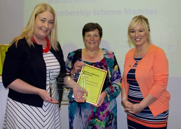 Karen Douglas, Service Manager at the Rowan, accepting the Making a Difference award from Louise Skelly, Patient and Client Council and Health Minister, Michelle ONeill. (Submitted Picture).