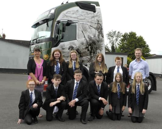 Junior School Pupils from Banbridge High pictured with the Baird Brothers Somme Lorry which has been decorated with scenes from the Attack of the Ulster Division to mark the Centenary of the Battle of the Somme, as part of the lorry's everyday work it travels close to the battlefields, included is past pupil William Baird and Head of History Marilyn Donaghy Â©Edward Byrne Photography INBL1626-220EB