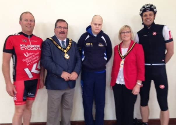 Dave Hoy (Kilbride Cyclists club secretary), Mayor John Scott, James McConnell (patient at CCU), Mayoress Audrey Scott and Dr Robert Johnston (Consultant Paediatric Oncologist). INNT 26-501CON