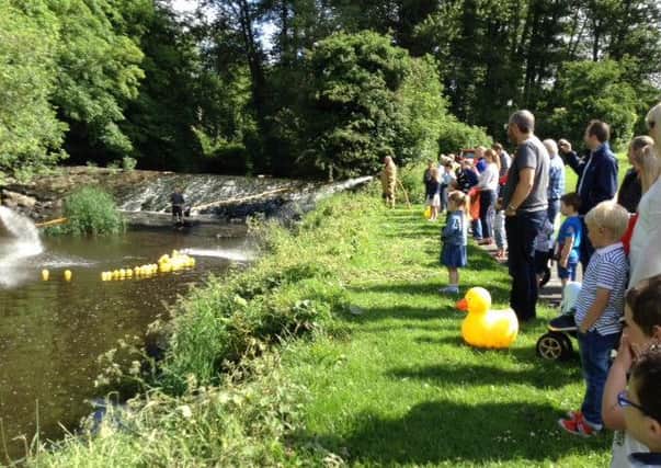 Pupils, parents, staff and friends enjoying the Dromore Nursery School end of year duck race.