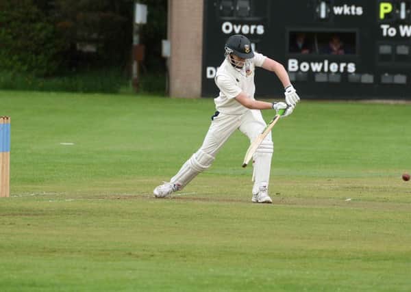 A Ballymena batsman stubbornly defends his wicket during Saturday's clash with Muckamore.