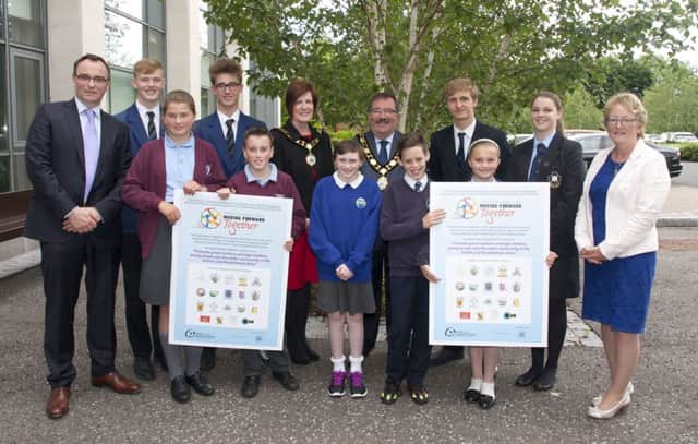 Back Row L-R: Philip Lavery (Chair of Moving Forward Together and VP of Mount St Michael's PS), Ethan Hutchinson and Ethan Angell (Antrim Grammar), Deputy Mayor, Councillor Noreen McClelland, Mayor Councillor John Scott, Head Boy - Sam Cunningham and Head Girl - Lily Appleyard (Parkhall Integrated College), Ruth Clarke (Vice Chair of Moving Forward Together and Principal of Roundtower Integrated PS).  Front Row L-R:  Ellie Robinson and Dylan Barnes (Greystone PS), Amber Lloyd (Riverside School), Curtis Allen and Atrice Mountcastle (St Joseph's PS).