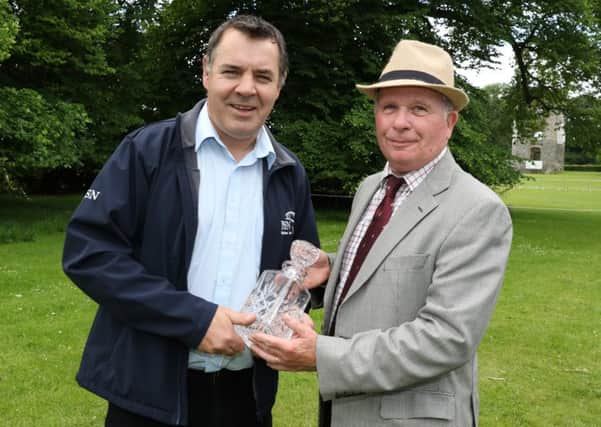 Paul Smith is pictured (right) receiving his award from Paul Pringle, NI Editor of Irish Country Sports & Country Life magazine and web portal.