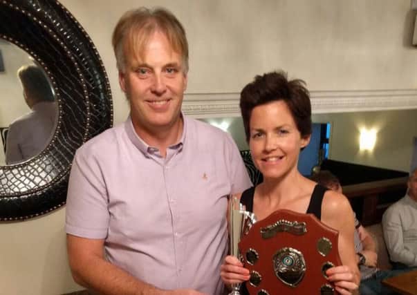 Ian Brennan presents Patricia Blair with the Larne AC Female Athlete of the Year award. INLT 26-909-CON