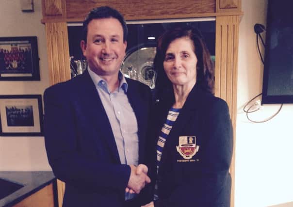 Roger Martin is welcomed to his new role at banbridge Hockey Club President by his predecessor Sheree Totton.