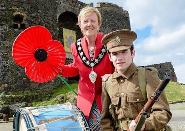 Mayor of Mid and East Antrim Borough Council, Councillor Audrey Wales MBE, is joined by a WWI soldier to commemorate the centenary of the Battle of the Somme.  Pic by Simon Graham / Harrison Photography  INCT 26-749-CON