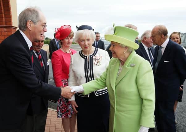 Press Eye - Belfast - Northern Ireland - 28th June 2016 

The Queen and The Duke of Edinburgh pictured at a Reception & Civic Lunch at Royal Portrush Golf Club, County Antrim

She is pictured with Her Majesty's Lord-Lieutenant for the County of Antrim Joan Christie meeting Sir Richard McLaughlin, Past Captain of Royal Portrush Golf Club.

Photo by Kelvin Boyes / Press Eye