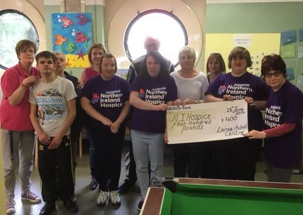 Staff and clients of Larne Adult Centre who took part in the Hospice Walk handi over a cheque for the Â£400 raised to Alice Crum of the NI Hospice.INLT-27-703-con