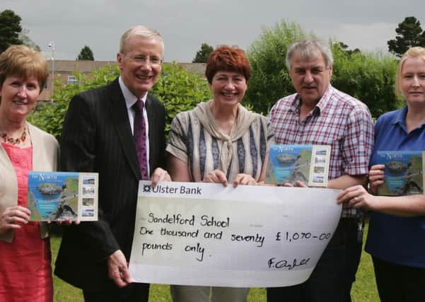 Mrs. Sharon Tennent, Principal, Sandelford School, receives a cheque for Â£1,070, the proceeds of a book produced by Maurice Bradley and published by Causeway Press. The book is still on sale and available in Waterstones Book Stores. All proceeds realised from teh sale of the book are being donated to Sandelford School. Pictured making tyhe presentation to Mrs. Tennent are Francis Campbell, Gregory Campbell, MP; Maurice Bradley, MLA, author and Nicky Newman, staff member. wk2629mb