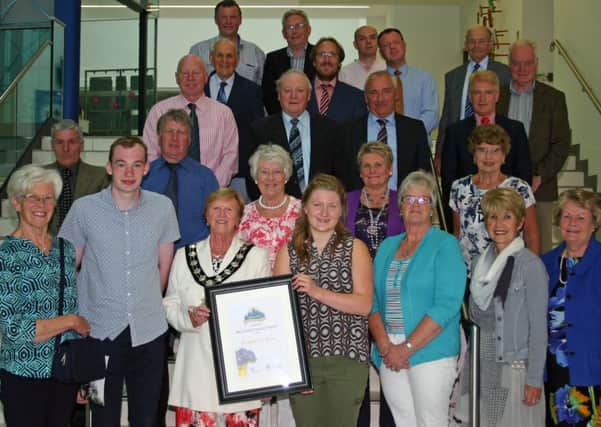 The Mayor of Mid and East Antrim Borough, Councillor Audrey Wales MBE, pictured with the group from Broughshane Improvement Committee
.