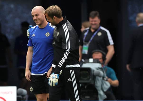 Portadown-born Luke McCullough (left) sharing a joke with Roy Carroll during a Northern Ireland training session at the Stade de Lyon in France. Pic by PressEye Ltd.