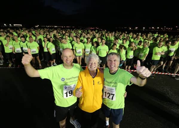 Dame Mary Peters with Finance Minister MÃ¡irtÃ­n O Muilleoir MLA and Rick Gillan from Grant Thornton NI at the start of the Runway Run.