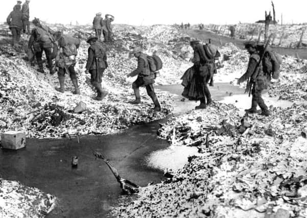 File photo dated 25/09/1916 of British soldiers negotiating a shell-cratered, Winter landscape along the River Somme in late 1916 after the close of the Allied offensive, as Queen Elizabeth II and senior royals will lead the nation in commemorating the Battle of the Somme today