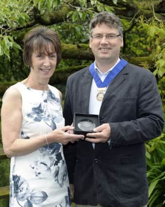 Banbridge Rotary Club President Gerry McElvogue presented Geraldine Hill with a Rotary Citizenship Award for her contribution within the community including serving with Banbridge Swimming Club for 27years Â©Edward Byrne Photography INBL1627-214EB