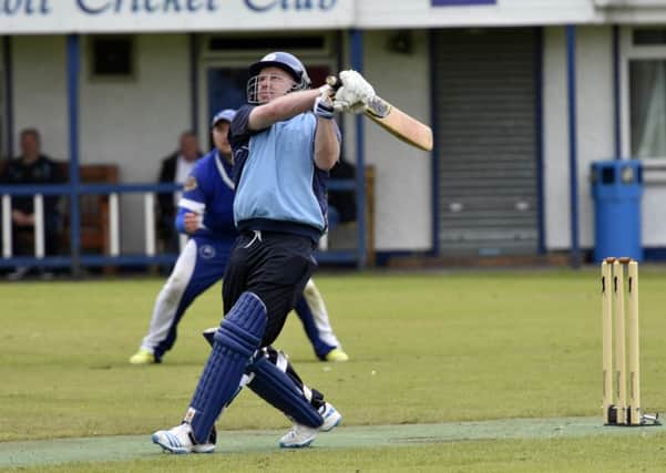 Gordon Montgomery smashes a 'six' for Glendermott during their match against Muckamore. INLS2716-165KM