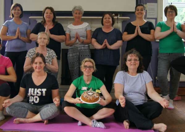 Participants in Louise's class recently celebrated International Yoga Day - complete with passion cake.