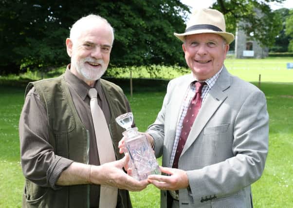Derek Beattie is pictured (left) receiving his award from Paul Pringle, NI Editor of Irish Country Sports & Country Life magazine and web portal.  INLT 27-650-CON