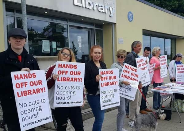 A protest was held in June over the proposed cuts at Carrickfergus Library. INCT 27-725-CON