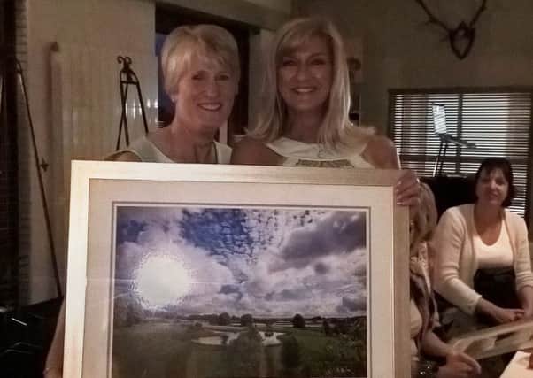 Overall winner Tricia Blaney receives her prize from Lady Captain Bernie Daly.