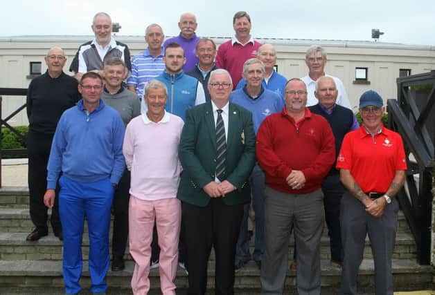 Galgorm Castle Golf Club Captain, Ian Henry with his guests before they tee off.