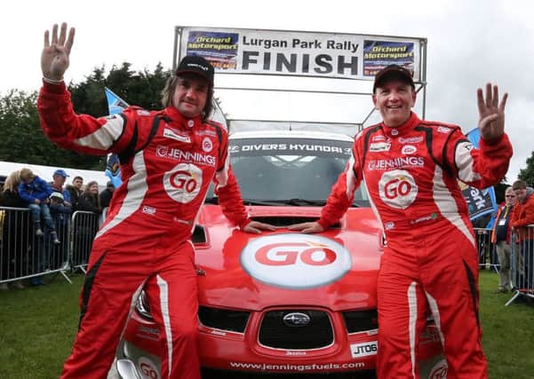 Garry Jennings and co-driver Michael Moran celebrate a fantastic four in a row at the Lurgan Park Rally held in the Park last Saturday.