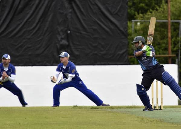 Glendermott professional Azeem Ghumman smashes this ball out to the boundary during Sunday's match against Muckamore. INLS2716-169KM