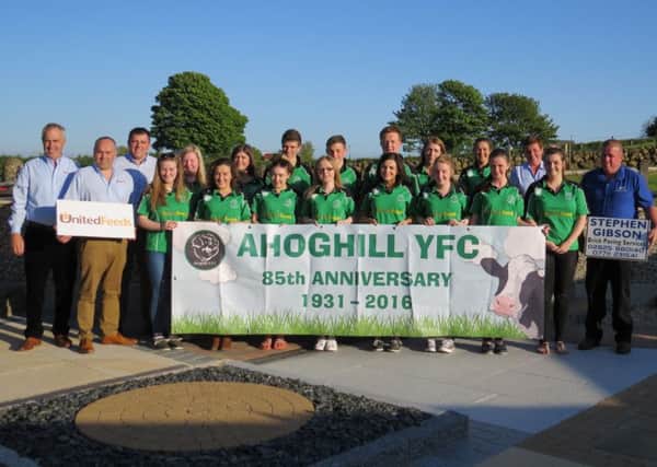 Ahoghill YFC members pictured with representatives from United and Stephen Gibson Brick Paving services who sponsored the Club's new tops. (Submitted Picture).