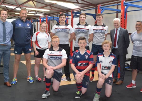 Head of the Hughes Insurance Ulster Rugby Academy, Mr Kieran Campbell, Mr. Stephen Black (Principal Ballymena Academy), 1st XV Coaches Mr. John Andrews and Mr. Gavin Murray with members of the school's rugby club.