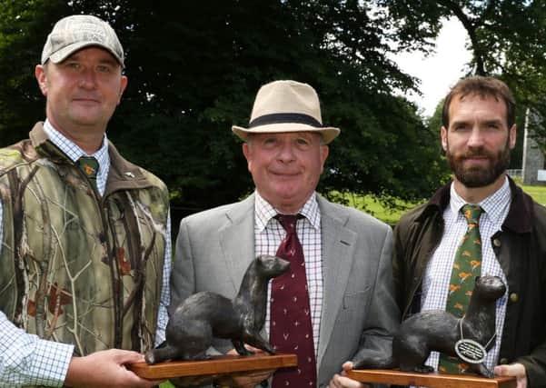 Graham Fyffe (left) and Darren Moore (right) are pictured receiving their awards from Paul Pringle, NI Editor of Irish Country Sports & Country Life magazine and web portal. INNT 27-809CON