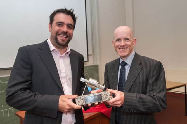 Owen McAuley receiving the Dayle Smyth Endeavour Award from Geoff Smyth.