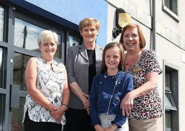 Celebrating New Haven's 10th anniversary are: (left to right) Housing Executive New Haven staff member, Yvonne Rawe; Housing Executive local office manager for Carrickfergus, Anne Glenn; Kaci-Mae Grady, now aged 10 and Housing Executive New Haven staff member, Valerie Ward.  INCT 27-730-CON