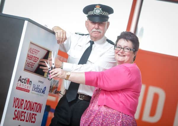 Police Sergeant, Jim Reynolds pictured with Action Cancer Ambassador Janet Gaw, from Carrick.  INCT 28-725-CON