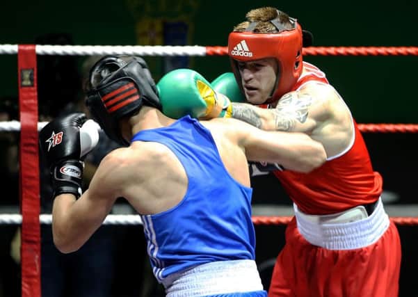 Ireland's Steven Donnelly (red) in action against Russia's Khariton Agrba (blue)
 during the Ballymena boxer's final fight on Irish soil in Dublin on Friday night, prior to heading to the Olympic Games in Rio. Picture: INPHO.