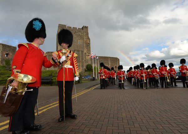 Irish Guards prepare to accompany vocalist Aled Jones as he performs at Carrick waterfront. INCT 27-704-CON