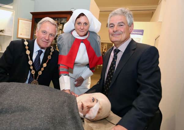 The Mayor, Councillor Brian Bloomfield MBE and Councillor Tim Morrow, Chairman of the Council's Leisure & Community Development Committee are pictured with a WW1 stretcher and wounded soldier, attended by a QAIMNS (Queen Alexandra Imperial Nursing Society) nurse.