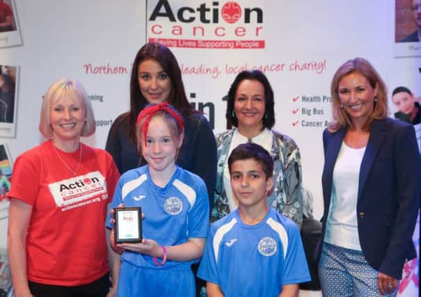 St Nicholas' PS pupils, Eimear Rice, Kiyan Hariri and teacher Geraldine Doherty (second right) picked up their silver award from Action Cancers Arlene Creighton, Centras Rachael Dalzell and host Claire McCollum.  INCT 26-746-CON