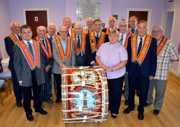 Brackagh Lambeg drum refurbished
A refurbished Lambeg drum, which pre-dates the Battle of the Somme, was dedicated at Brackagh Orange Hall at the weekend.
 Members of LOL 18 met for the dedication of the drum by Rev Elizabeth Cairns, Rector of Mullavilly Parish Church. It was re-painted by Richhill artist Andrew Young and depicts the War Memorial in Portadown.
 Brackagh Worshipful Master Samuel McIntyre unveiled the drum which will be seen and heard over the Twelfth period in Portadown, the venue of the County Armagh demonstration.
 The drum is well over 100 years old, and it was refurbished to mark the centenary of the Battle of the Somme.
 The picture shows members of the lodge with Rev Elizabeth Cairns who dedicated the drum.