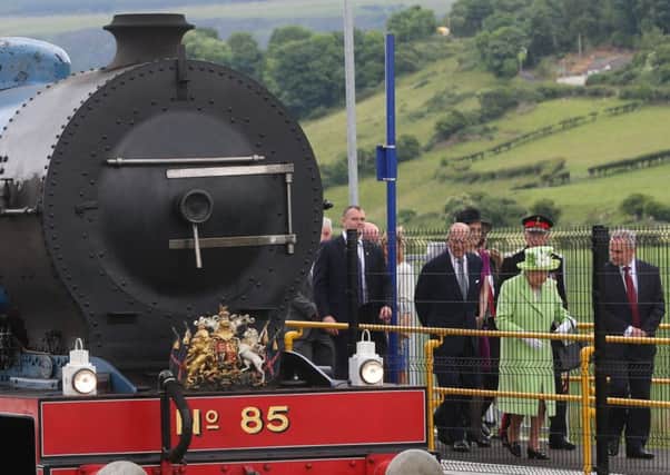 Queen Elizabeth II and the her husband, the Duke of Edinburgh arrive at Bellarena railway station after travelling from Coleraine by steam train during the second day of her visit to Northern Ireland to mark her 90th birthday. PRESS ASSOCIATION Photo. Picture date: Tuesday June 28, 2016. See PA story ROYAL Ulster. Photo credit should read: Niall Carson/PA Wire