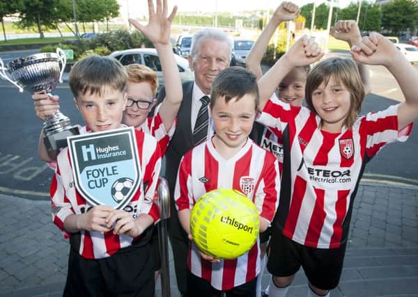 Former Republic of Ireland international footballer Johnny Giles pictured with members of Derry City Colts team, at this years Hughes Insurance Foyle Cup launch.