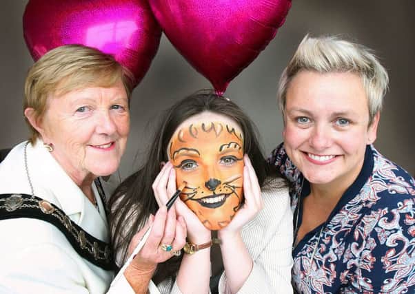 Teen heart charity, BraveheartsNI, is set for roaring success as the Mayor of Mid and East Antrim Borough Council, Councillor Audrey Wales MBE, recently announced the organisation as her chosen charity for her 2016-17 term in office. Pictured making the finishing touches to local 'braveheart', Shealyn Caulfiend (age 17), are mum and charity founder Clare Caulfield, and Mayor of Mid and East Antrim, Councillor Audrey Wales, MBE.