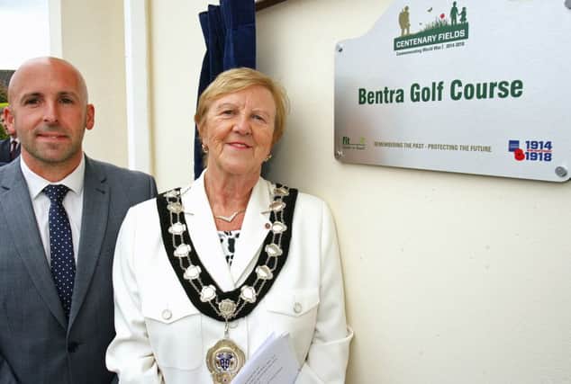 The Mayor of Mid and East Antrim Borough, Councillor Audrey Wales MBE, and Terry Housden, Fields in Trust development manager (South East of England and Northern Ireland), officially unveil the commemorative plaque naming Bentra as a Centenary Field. INCT28-702-CON