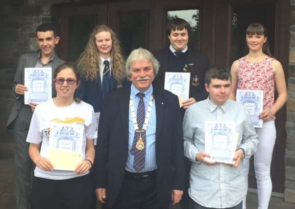 Leonard Sproule, 2015/16 president of the Rotary Club of Newtownabbey, with students who received awards. INNT 27-599CON