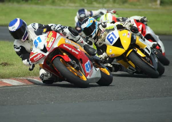 Dundrod's Robert Kennedy leads Antrim rider Ross Patterson in the Supersport 600 race. Picture: Roy Adams.,