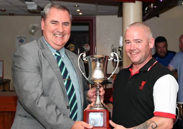 Colin Johnston (right) collects the Mid-Ulster League Division Two trophy on behalf of Rectory Rangers from Sean O'Neill (league chairman). Pic by RicPics.