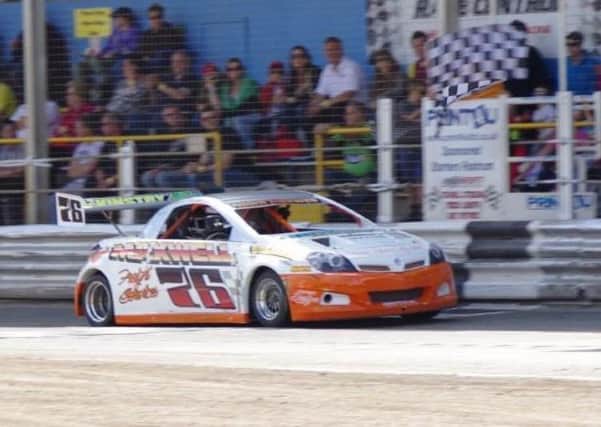 Adam Maxwell takes the chequered flag to win the National Hot Rod World Final. Picture: Martin Kingston.