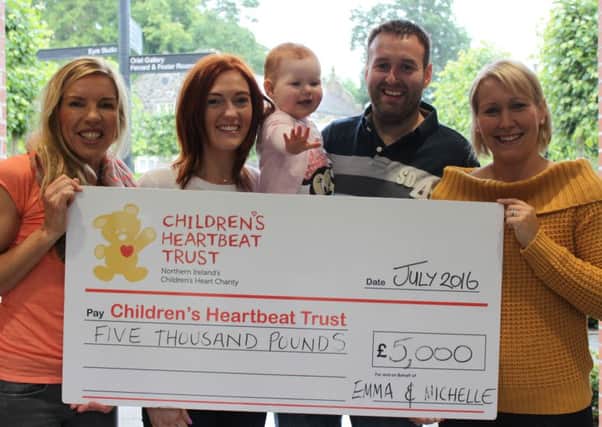 Michelle Raphael and Emma Millar from Randalstown (left and right) are pictured with Lynda, Colin and baby Alexis Millar (centre) presenting a Â£5,000 Cheque for Children's Heartbeat Trust.  Emma and Michelle held a charity Ball at Galgorm Manor in May in aid of Children's Heartbeat Trust. (Submitted Picture).