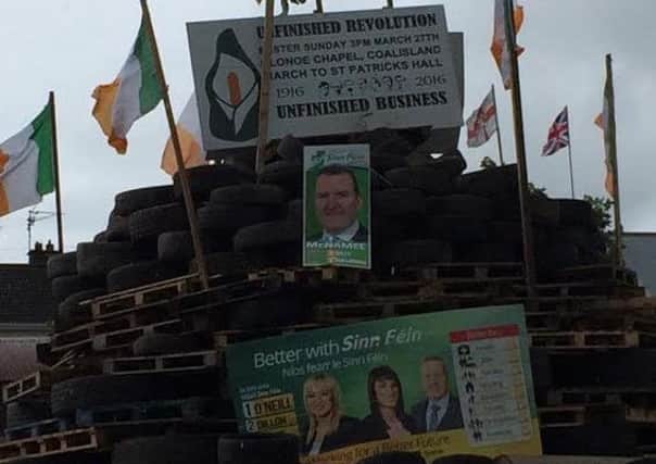 Ireland flags and Sinn Fein election posters on Cookstown bonfire
