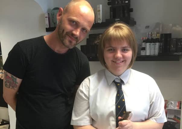 Shannon Cunningham with Billy, from  Studio 10 hairdressers in Carrick, after having her locks cut for charity. INCT 28-756-CON