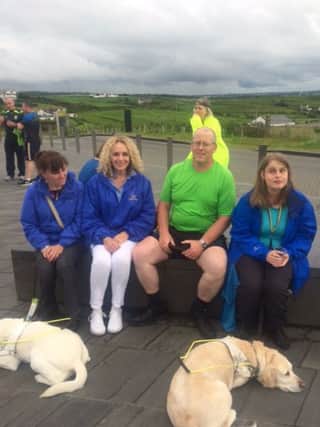 Brian with Torie and guide dog Ushi, Ann with guide dog Flossie, from Ballymena Fundraising Branch  and Lesley Macaulay, Regional Fundraising Manager.